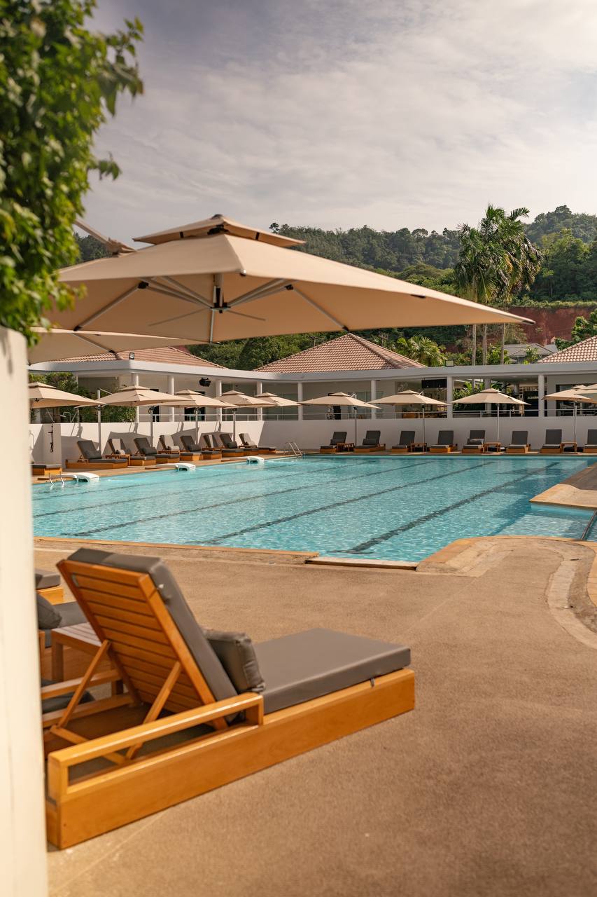 Large soft sun loungers by the pool at KAIF Jungle Club & Spa